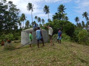 People around a water tank