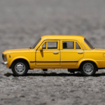 Close-up of yellow toy 1967 Volvo 144.